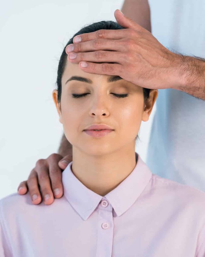 cropped view of healer putting hand on head of att 2023 11 27 05 28 25 utc