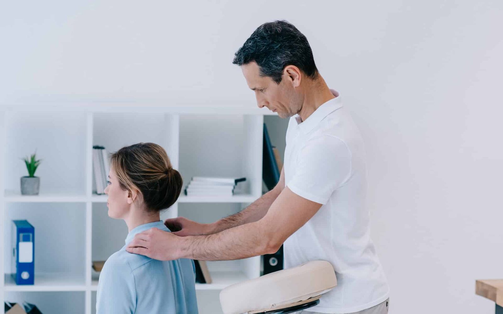 handsome mature masseur doing office massage for b 2023 11 27 05 03 48 utc