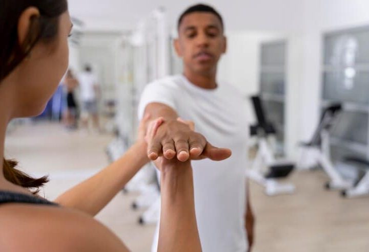 medical assistant helping patient with physiotherapy exercises 23 2149071505