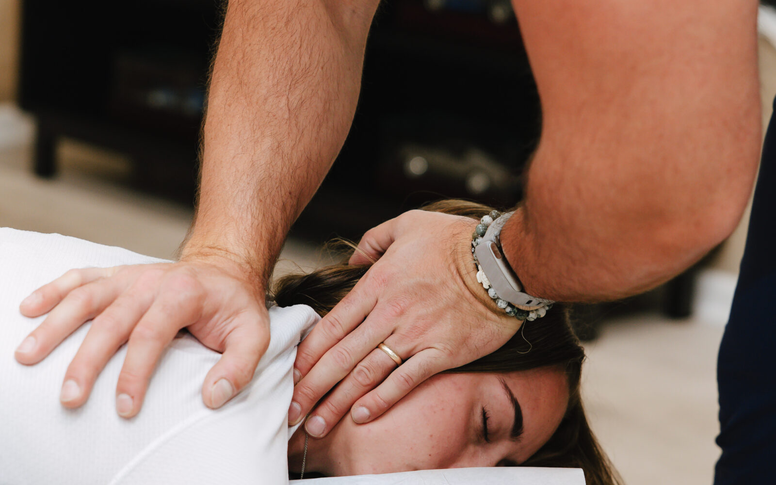 Precise hands-on cervical adjustment at Forza Chiropractic