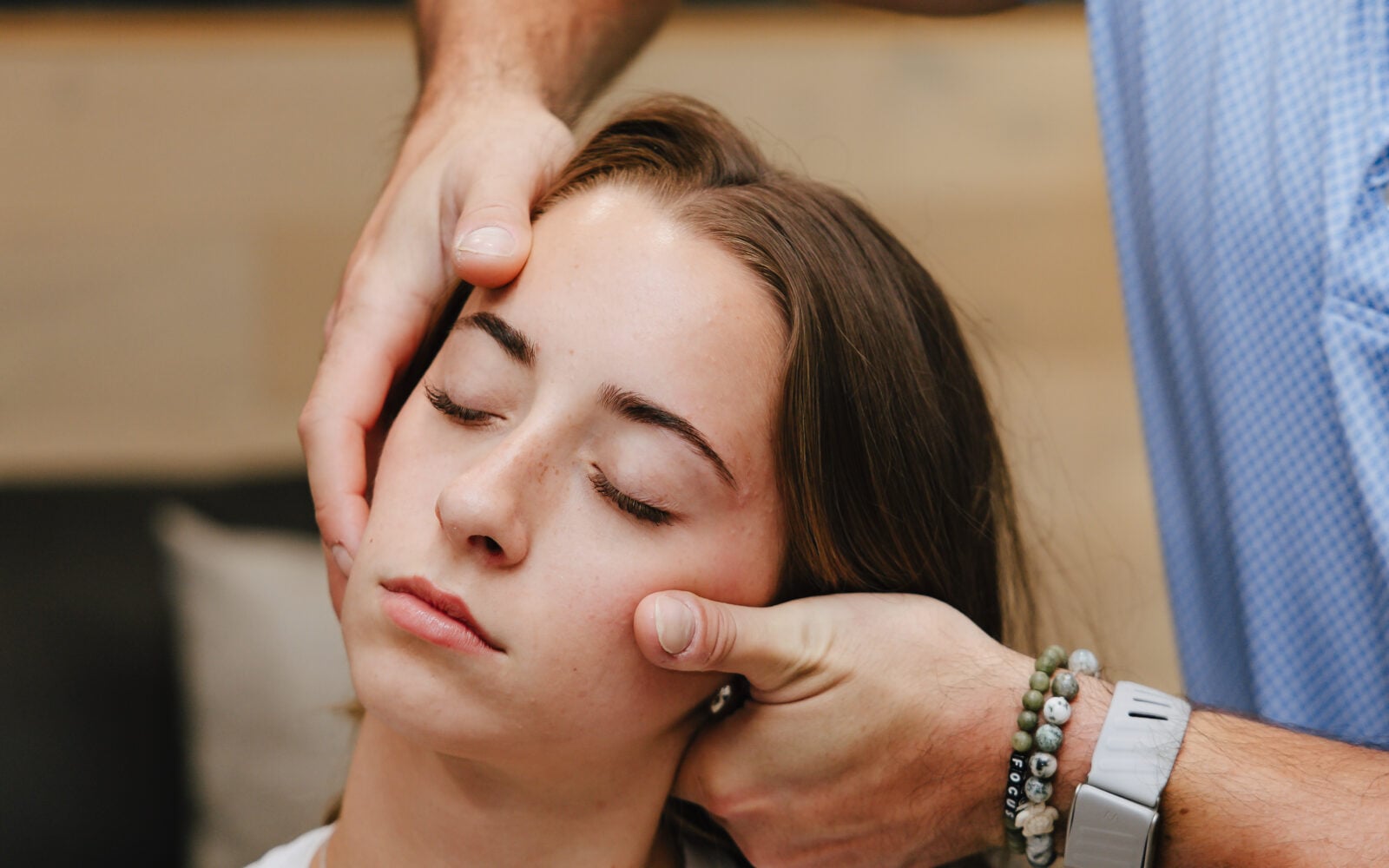 Gentle hands-on head and neck assessment at Forza Chiropractic