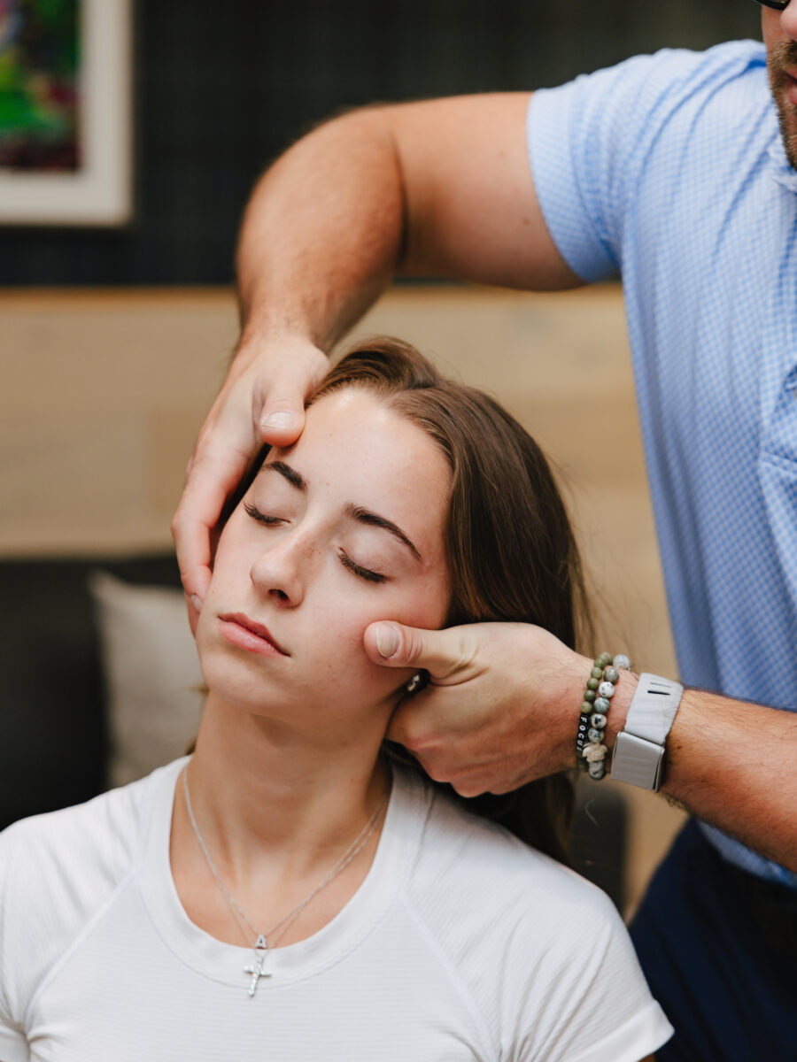 Gentle hands-on head and neck assessment at Forza Chiropractic