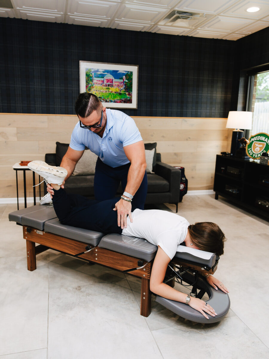 Chiropractic adjustment on the treatment bench at Forza Chiropractic